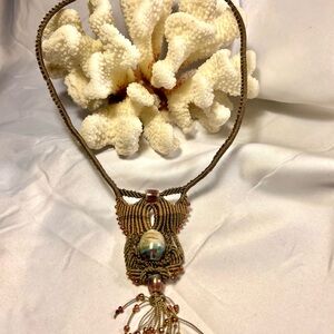 Handmade Macrame Beaded Necklace features a central Ceramic Bead & Tassel.